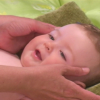 Face massage on an infant